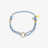 Blue braided bracelet with gold accents on a white background