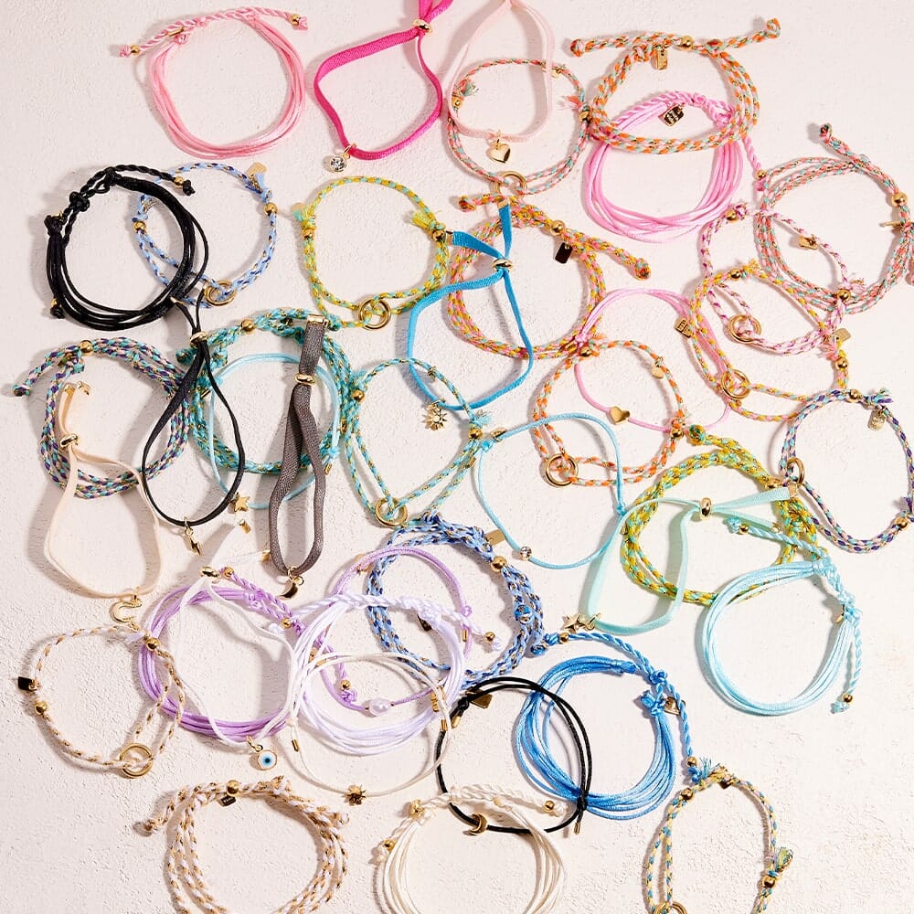 Collection of colorful bracelets on a light background