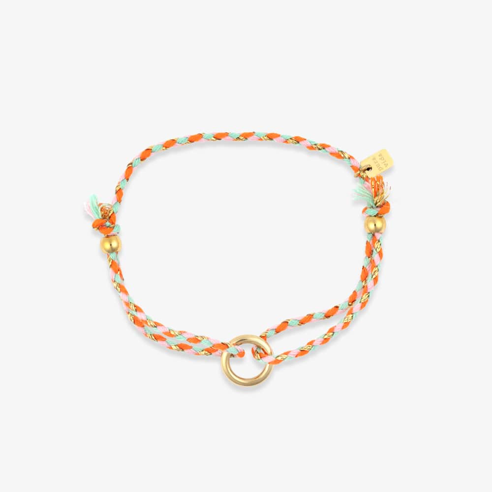 Bracelet with orange and gold accents on a white background