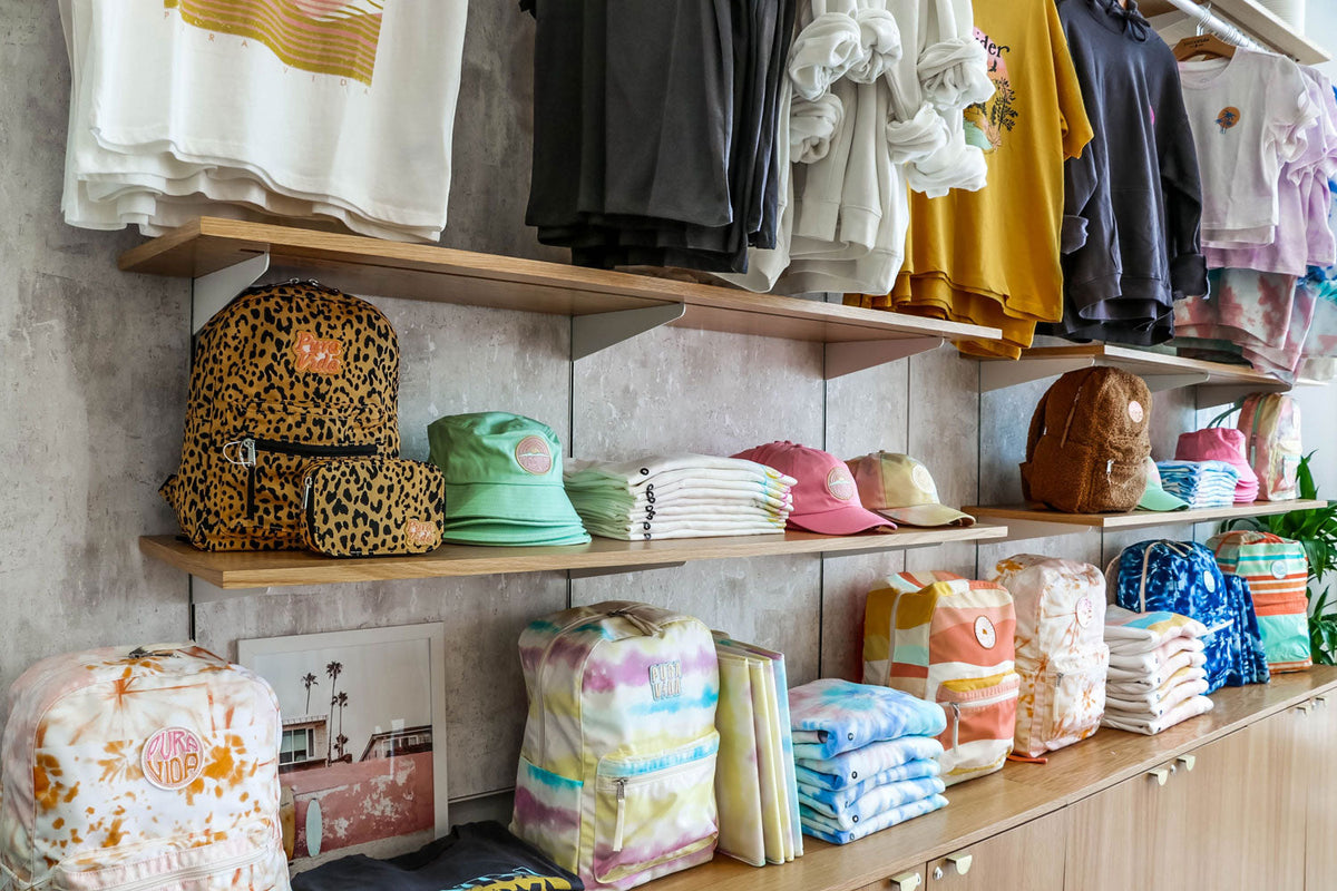 Pura Vida hats and bags on a shelf